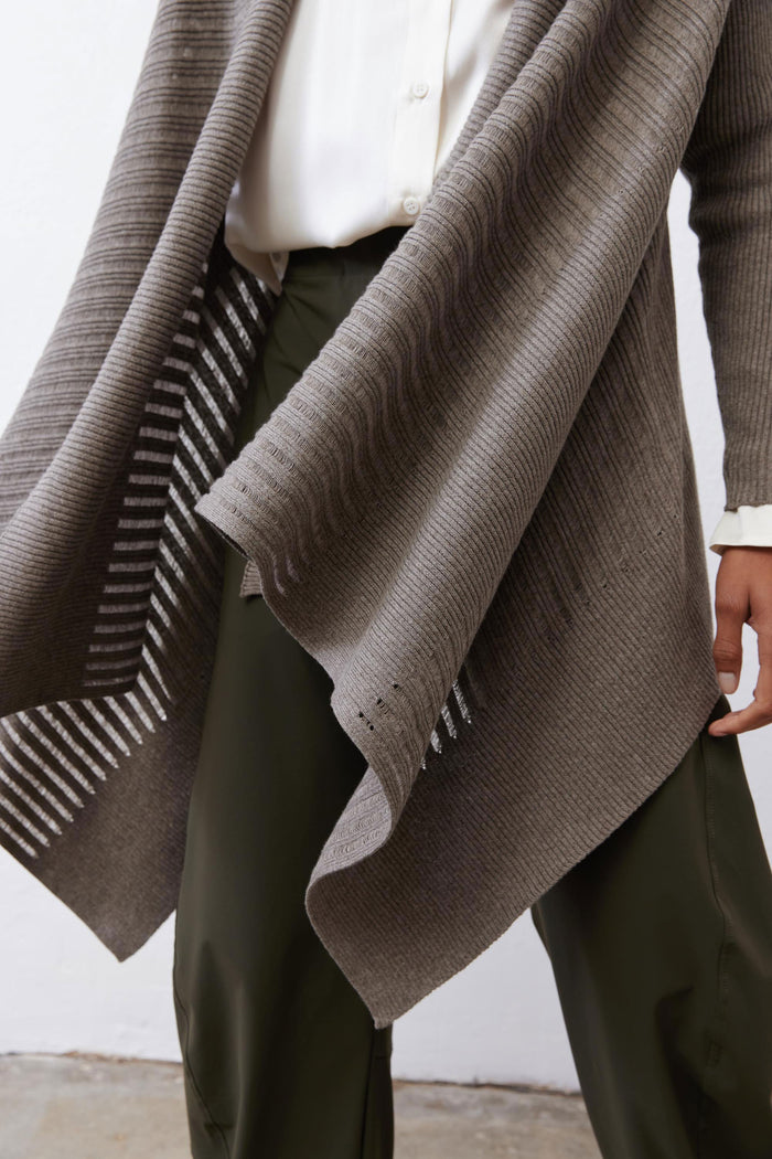 Sea gray open-knit cardigan close-up showing draped hem and knit texture