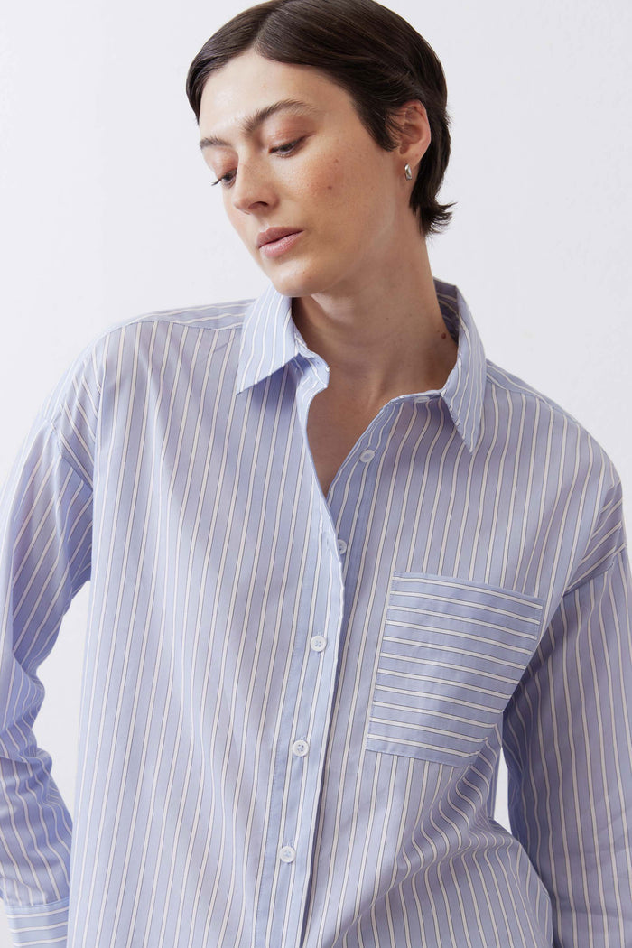 Light blue striped oversized button-down shirt with chest pocket, front view