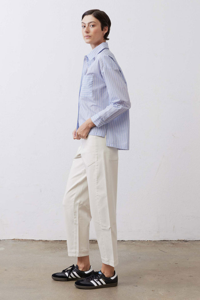 Light blue striped button-down shirt with long sleeves and side view
