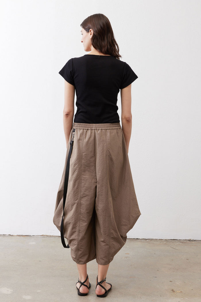 Walnut wide-leg parachute pants, back view: elastic waist, drawstring, side pocket flaps