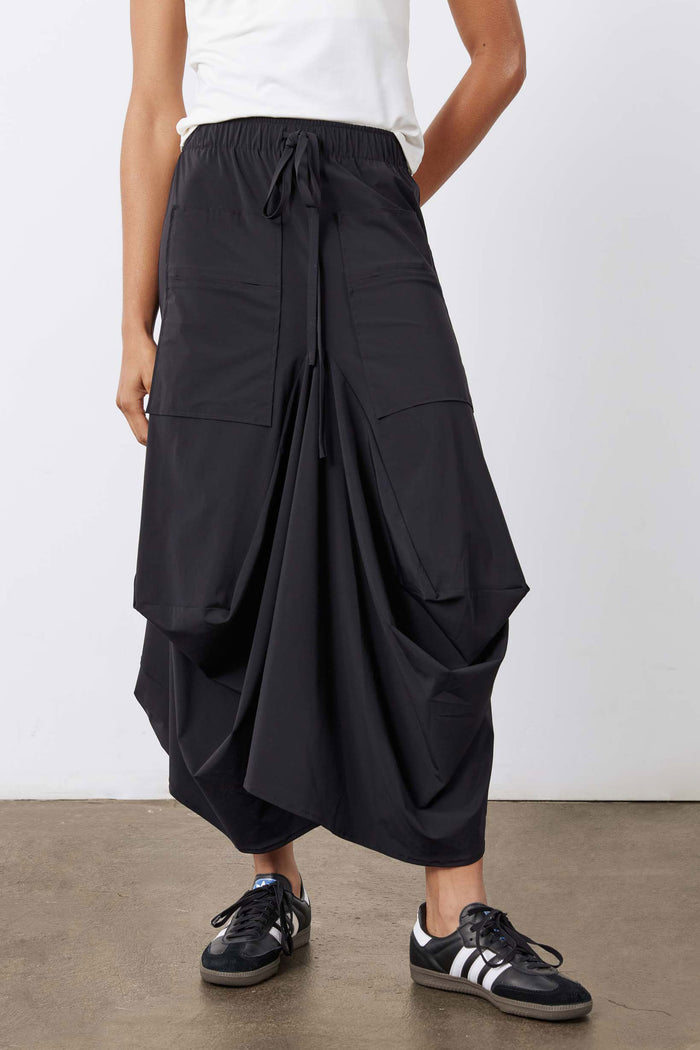 Black cargo-style midi skirt with drawstring waist and large side pocket panels