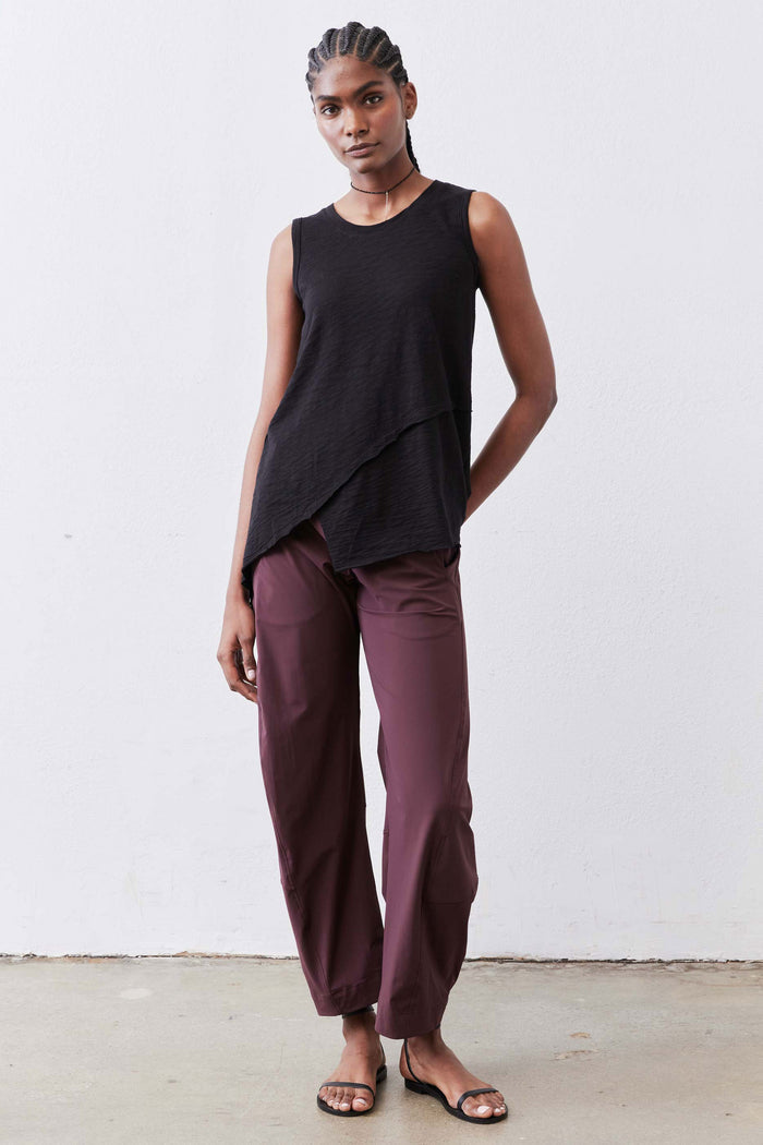 Relaxed aubergine work pants with loose taper-free legs and elastic waistband at the waist