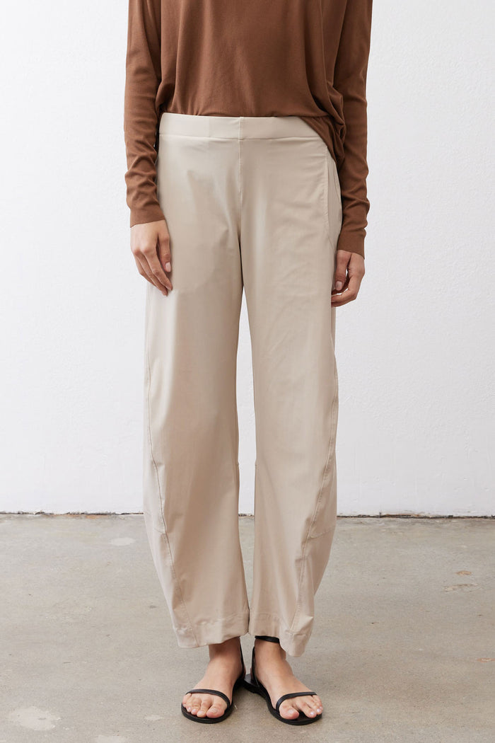 Light beige work pants with relaxed straight legs and elastic waistband