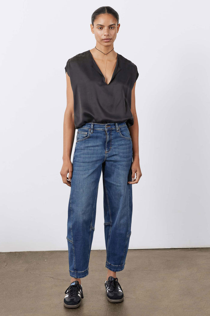 Indigo barrel-leg jeans with mid-rise waist and classic five-pocket design