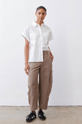 Walnut-brown cargo barrel pants with front and side pockets, relaxed straight legs