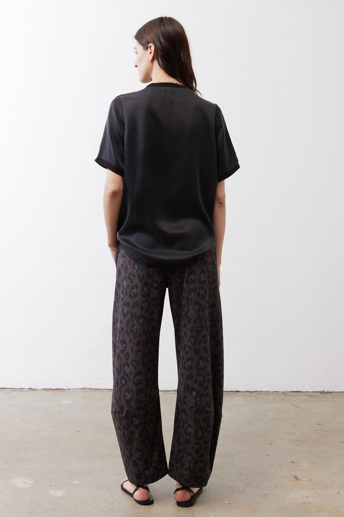 Black short-sleeve silk top, crew neck, loose back view
