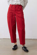 Scarlet twill pants, side view, belted waist with button fly and cargo-style pockets
