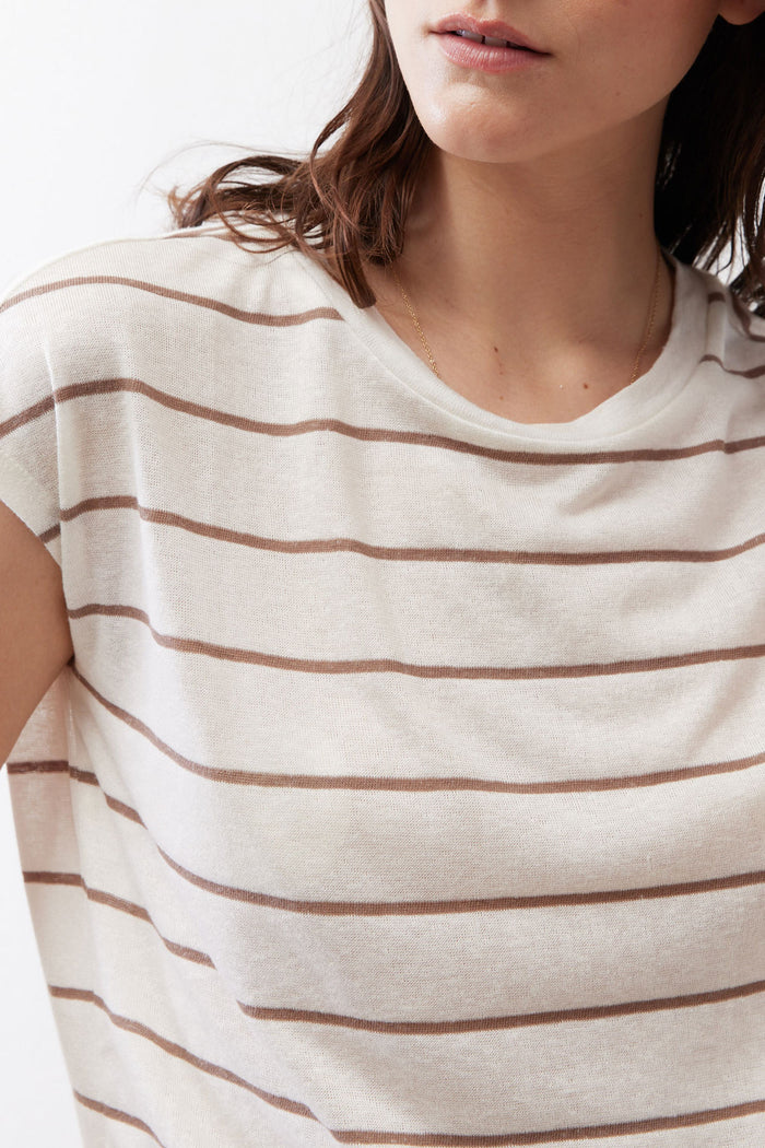 Cream knit tee close-up with light brown horizontal stripes and crew neck