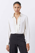 Off-white tux-style blouse with pointed collar, button front, pleated vertical trim