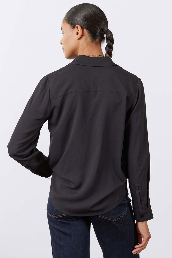 Black long-sleeve blouse with back yoke seam and point-collar back