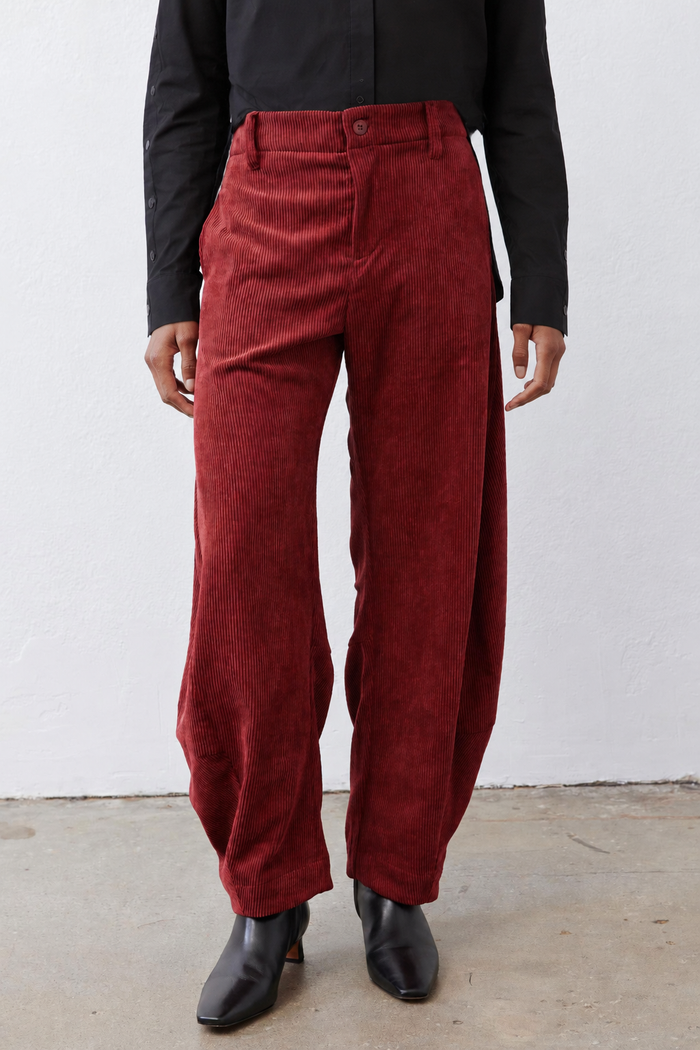 Pomegranate corduroy barrel pants front view with belt loops and pleated details