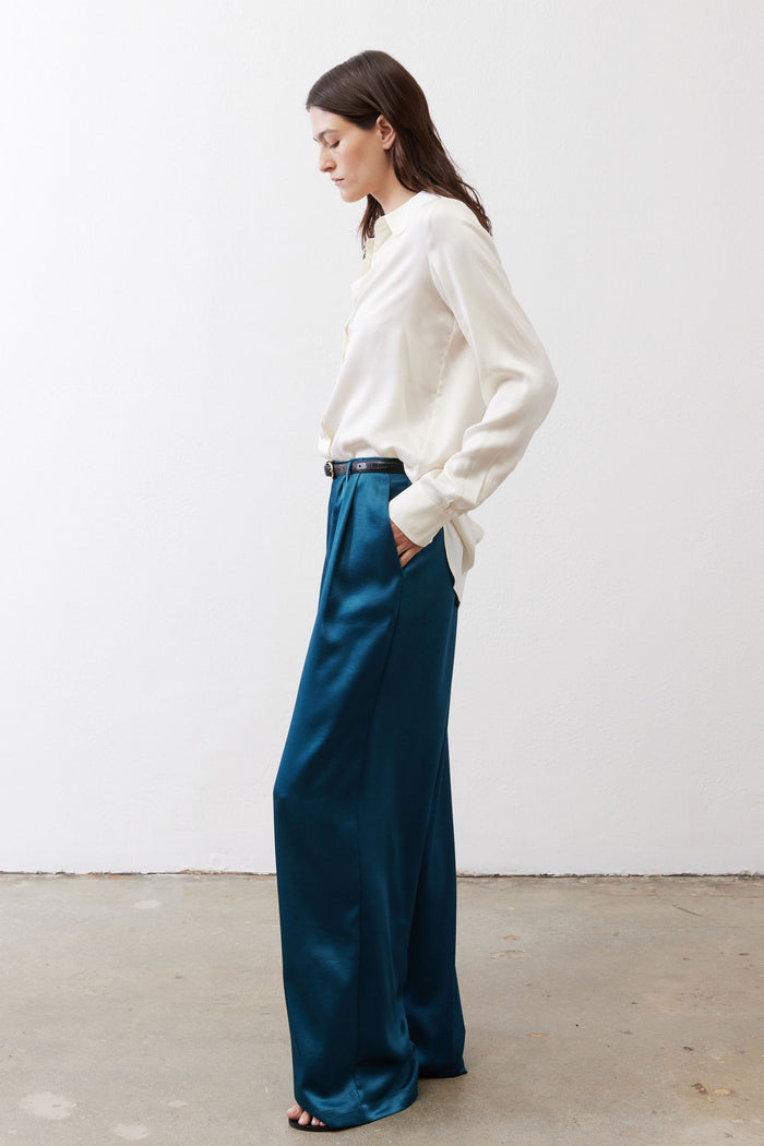 Deep teal satin wide-leg trousers with elastic waistband and side pockets