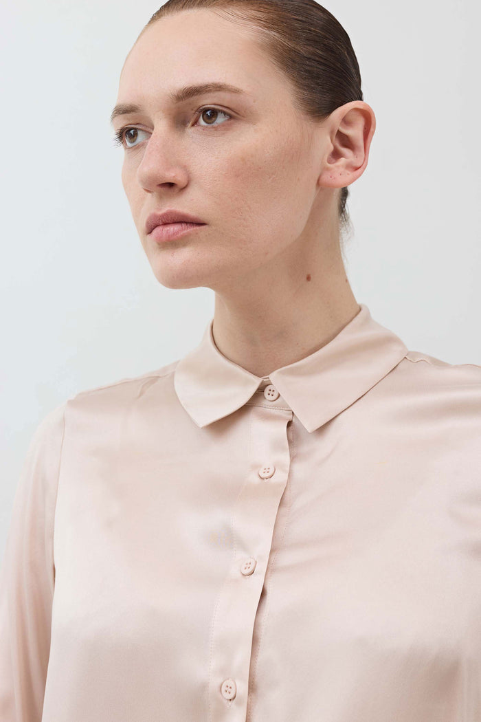Peach blush silk button-down top close-up of collar and front button placket