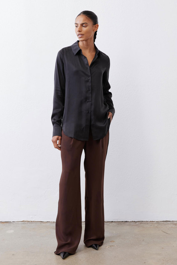 Black silk button-down top with pointed collar and button front, long sleeves
