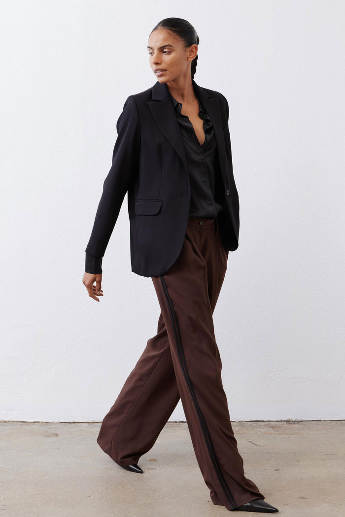 Black silk button-down top with pointed collar and button front, long sleeves